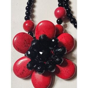 Long sterling silver clasp and dyed coral flower necklace  by AIL Statement